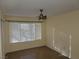 Well-lit bedroom featuring a ceiling fan and a large window at 5710 E Tropicana Ave # 1172, Las Vegas, NV 89122