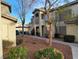 Charming condo building with inviting walkway, mature trees and lush landscaping at 5710 E Tropicana Ave # 1172, Las Vegas, NV 89122