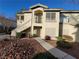 Attractive condo building with covered porch and lush landscaping at 5710 E Tropicana Ave # 1172, Las Vegas, NV 89122