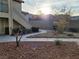 Inviting walkway leading to well maintained condo units and lush landscaping at 5710 E Tropicana Ave # 1172, Las Vegas, NV 89122