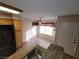 Cozy kitchen featuring granite countertops and stainless steel appliances overlooking a dining area at 5710 E Tropicana Ave # 1172, Las Vegas, NV 89122