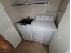 Laundry room featuring a washer and dryer with wire rack shelves at 5710 E Tropicana Ave # 1172, Las Vegas, NV 89122