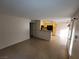 Open living area with tile flooring, connecting to the kitchen at 5710 E Tropicana Ave # 1172, Las Vegas, NV 89122
