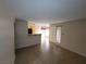 Bright living room with tile flooring leading into dining area and a kitchen bar at 5710 E Tropicana Ave # 1172, Las Vegas, NV 89122