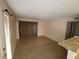 Cozy living room with sliding glass door and granite breakfast bar at 5710 E Tropicana Ave # 1172, Las Vegas, NV 89122
