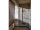 Small, enclosed patio area with exterior door and window at 5710 E Tropicana Ave # 1172, Las Vegas, NV 89122
