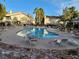 Relax by the pool surrounded by palm trees and lounge chairs at this community at 5710 E Tropicana Ave # 1172, Las Vegas, NV 89122