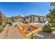 Spacious backyard offers a fire pit, covered outdoor kitchen, and a swimming pool at 5855 Boulder Brook Ct, Las Vegas, NV 89149
