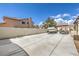 Spacious backyard featuring a concrete driveway and gravel landscaping at 5855 Boulder Brook Ct, Las Vegas, NV 89149