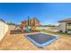 Backyard with a playground, a trampoline, and ample space for outdoor activities at 5855 Boulder Brook Ct, Las Vegas, NV 89149
