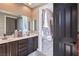 Well-lit bathroom with dual vanity at 5855 Boulder Brook Ct, Las Vegas, NV 89149