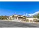 Beautiful single story home featuring a desert landscaped yard and a three-car garage at 5855 Boulder Brook Ct, Las Vegas, NV 89149