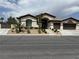 Charming single-story home featuring a well-manicured front yard and a two-car garage at 5855 Boulder Brook Ct, Las Vegas, NV 89149