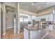 Spacious kitchen with stainless steel appliances and a gray kitchen island with granite countertop at 5855 Boulder Brook Ct, Las Vegas, NV 89149