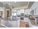 Well-equipped kitchen featuring stainless steel appliances, granite countertops, and white cabinets at 5855 Boulder Brook Ct, Las Vegas, NV 89149