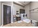 Functional laundry room with a sink, cabinets, and a washer/dryer set at 5855 Boulder Brook Ct, Las Vegas, NV 89149