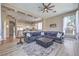 Open living area connects to kitchen; features large couch, contemporary design at 5855 Boulder Brook Ct, Las Vegas, NV 89149