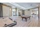 Open-concept living space with hardwood floors, recessed lighting, and multiple living spaces at 5855 Boulder Brook Ct, Las Vegas, NV 89149