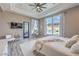 Bright, spacious main bedroom with a large window, light colored walls and wood-look floors at 5855 Boulder Brook Ct, Las Vegas, NV 89149