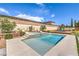 Beautiful pool and spa area with lounge chairs and mature landscaping in backyard at 5855 Boulder Brook Ct, Las Vegas, NV 89149