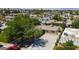 Aerial view of the home showcases its well-maintained landscaping, spacious driveway and neighborhood at 6320 Shawnee Ave, Las Vegas, NV 89107