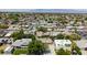 Areal view of residential neighborhood and rooftops with mature trees, offering suburban living close to amenities at 6320 Shawnee Ave, Las Vegas, NV 89107