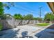 View of the backyard with storage shed, rock, and artificial turf for easy maintenance at 6320 Shawnee Ave, Las Vegas, NV 89107