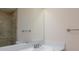 Updated bathroom featuring a stylish vanity, large mirror, and a beautifully tiled shower at 6320 Shawnee Ave, Las Vegas, NV 89107
