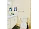Bathroom with single sink vanity, a toilet and modern fixtures at 6320 Shawnee Ave, Las Vegas, NV 89107