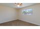 Cozy bedroom featuring neutral carpet, paint, trim, and a classic ceiling fan at 6320 Shawnee Ave, Las Vegas, NV 89107