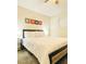 Relaxing bedroom with an accent wall hanging above a comfy bed with a side table at 6320 Shawnee Ave, Las Vegas, NV 89107