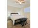 Cozy bedroom with a queen bed, ceiling fan and natural light from a window at 6320 Shawnee Ave, Las Vegas, NV 89107