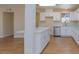 View of updated kitchen and living space, complete with stainless appliances at 6320 Shawnee Ave, Las Vegas, NV 89107