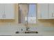 Close up view of kitchen sink and window at 6320 Shawnee Ave, Las Vegas, NV 89107