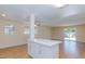 Open living area with island, ceiling fan and sliding door to the back yard at 6320 Shawnee Ave, Las Vegas, NV 89107