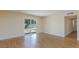 Well-lit living area with slider to back yard and view of hallway at 6320 Shawnee Ave, Las Vegas, NV 89107