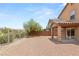 Spacious backyard showcasing a covered patio area, mature trees, and privacy fencing at 6480 Chebec St, North Las Vegas, NV 89084