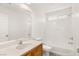 Clean bathroom with tub/shower combo, oak vanity, and neutral finishes at 6480 Chebec St, North Las Vegas, NV 89084