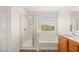 Bright bathroom featuring a walk-in shower and separate bathtub at 6480 Chebec St, North Las Vegas, NV 89084