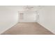 Spacious bedroom featuring neutral carpet, ceiling fan, and large window at 6480 Chebec St, North Las Vegas, NV 89084