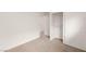 Clean bedroom with neutral carpet and large closet for ample storage space at 6480 Chebec St, North Las Vegas, NV 89084