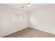 Well-lit bedroom with plush carpeting, a window, fresh paint, and a ceiling light at 6480 Chebec St, North Las Vegas, NV 89084