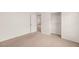 Carpeted bedroom with adjacent closet, neutral walls, and carpet at 6480 Chebec St, North Las Vegas, NV 89084