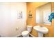 Stylish powder room featuring a pedestal sink and decorative mirror at 6529 Cinnamon Hazelnut Ave # Lot 93, North Las Vegas, NV 89084
