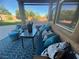 Comfortable covered patio with plush seating, pillows, and a view of the backyard at 6756 Sea Swallow St, North Las Vegas, NV 89084