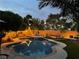 Backyard oasis with a private pool, string lights, and lush landscaping for relaxing outdoor living at 6756 Sea Swallow St, North Las Vegas, NV 89084