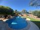 Beautiful backyard pool surrounded by lush landscaping, perfect for relaxation and entertaining at 6756 Sea Swallow St, North Las Vegas, NV 89084