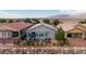 Backyard patio area with outdoor seating and desert landscaping at 7029 Bocaire Dr, Las Vegas, NV 89131
