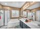 Bathroom featuring a separate tub and shower at 7029 Bocaire Dr, Las Vegas, NV 89131