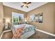 Cozy bedroom features bright natural light, plush carpet, and a comfortable bed with stylish decor at 7029 Bocaire Dr, Las Vegas, NV 89131